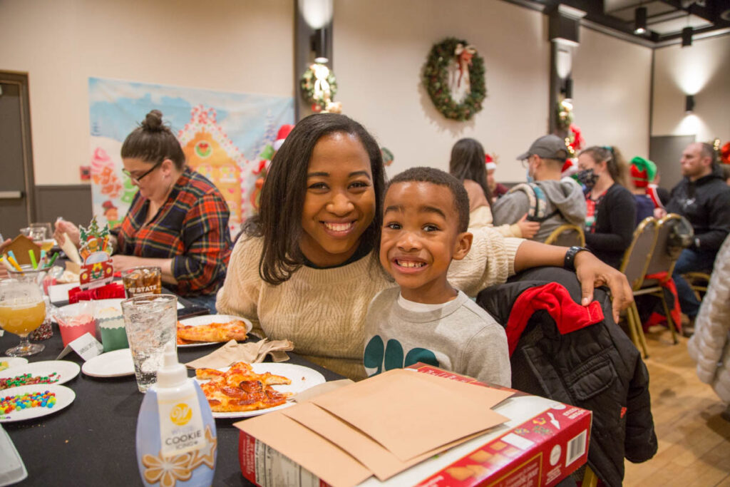 Mother and son having Christmas fun at 49th State Brewing